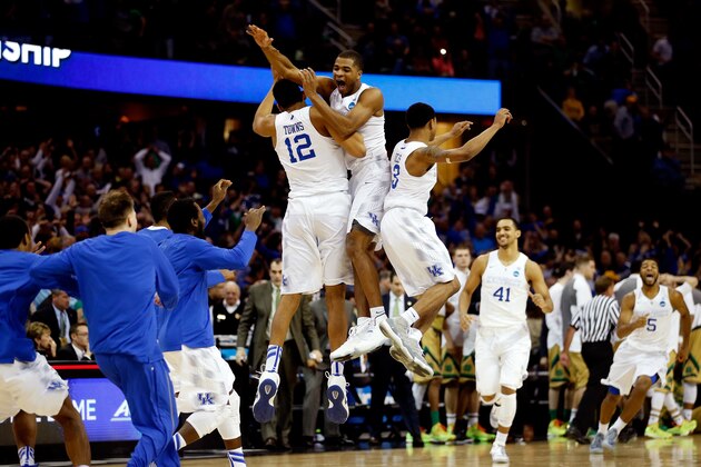 CLEVELAND, OH - MARCH 28:  Aaron Harrison #2 of the Kentucky Wildcats celebrates with teammates after defeating the Notre Dame Fighting Irish during the Midwest Regional Final of the 2015 NCAA Men's Basketball tournament at Quicken Loans Arena on March 28, 2015 in Cleveland, Ohio.  (Photo by Gregory Shamus/Getty Images)