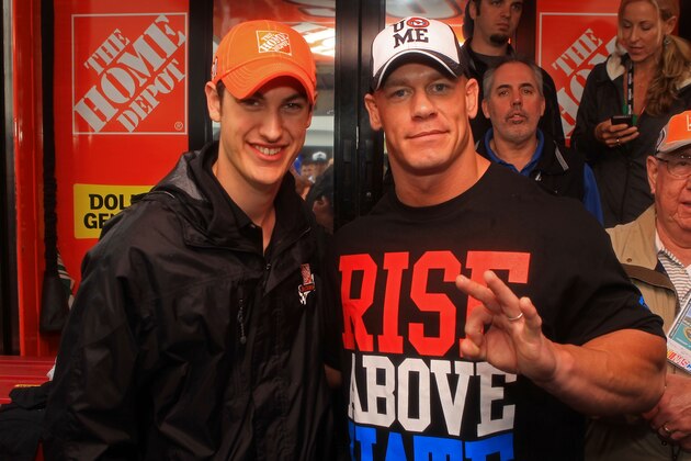 DAYTONA BEACH, FL - FEBRUARY 26:  Joey Logano (L), driver of the #20 The Home Depot Toyota, poses with professional wrestler John Cena in the garage area prior to the start of the NASCAR Sprint Cup Series Daytona 500 at Daytona International Speedway on February 26, 2012 in Daytona Beach, Florida.  (Photo by Matthew Stockman/Getty Images)