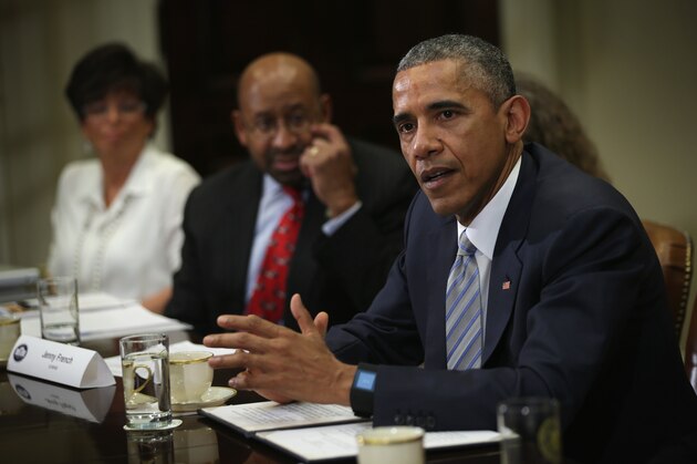 WASHINGTON, DC - MARCH 25:  U.S. President Barack Obama speaks as White House senior adviser Valerie Jarrett (L) and Philadelphia Mayor Michael Nutter (2nd L) listen during a Roosevelt Room event at the White House March 25, 2015 in Washington, DC. President Obama met with local elected officials and small business exporters on trade..  (Photo by Alex Wong/Getty Images)