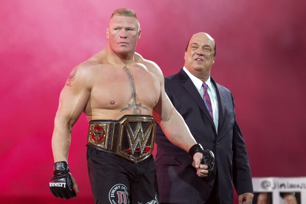 WWE Superstar Brock Lesnar heads to the ring at Wrestle accompanied by manager Paul Heman during  WrestleMania 31 at Levi's Stadium on Sunday, March 29, 2015 in Santa Clara, CA. Lesner eventually lost his championship to Seth Rollins. (Don Feria/AP Images for WWE)