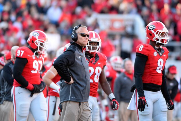 Georgia head coach Mark Richt works the sidelines against Georgia Tech during the second half of an NCAA college football game Saturday, Nov. 29, 2014, in Athens, Ga. Georgia Tech won 30-24 in overtime after Georgia quarterback Hutson Mason's pass was intercepted by D.J. White. (AP Photo/David Tulis)