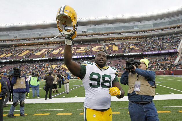 Green Bay Packers nose tackle Letroy Guion celebrates after an NFL football game against the Minnesota Vikings, Sunday, Nov. 23, 2014, in Minneapolis. The Packers won 24-21. (AP Photo/Ann Heisenfelt)