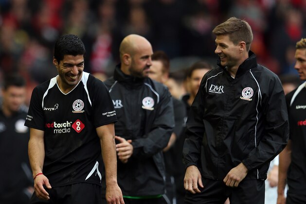 LIVERPOOL, ENGLAND - MARCH 29: Luis Suarez and Steven Gerrard of the Gerrard XI share a laugh at full time following the Liverpool All-Star Charity match at Anfield on March 29, 2015 in Liverpool, England. (Photo by Chris Brunskill/Getty Images)