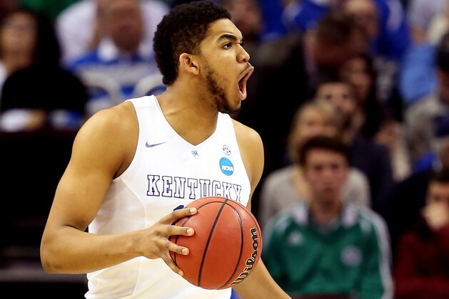 CLEVELAND, OH - MARCH 28: Karl-Anthony Towns #12 of the Kentucky Wildcats reacts after being called for a foul in the second half against the Notre Dame Fighting Irish during the Midwest Regional Final of the 2015 NCAA Men's Basketball tournament at Quicken Loans Arena on March 28, 2015 in Cleveland, Ohio.  (Photo by Andy Lyons/Getty Images)