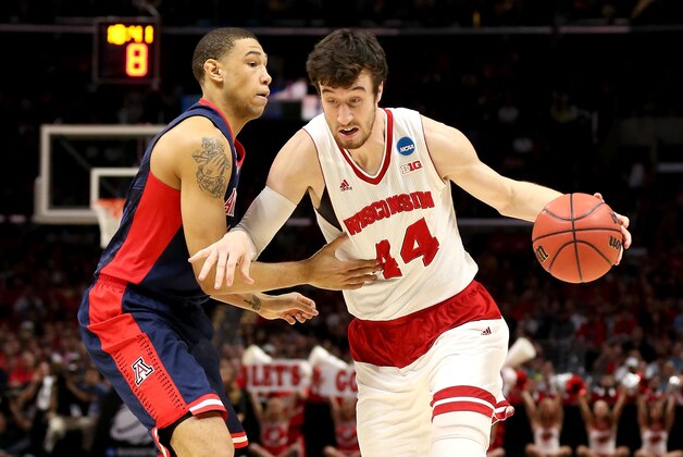 LOS ANGELES, CA - MARCH 28:  Frank Kaminsky #44 of the Wisconsin Badgers drives on Brandon Ashley #21 of the Arizona Wildcats in the first half during the West Regional Final of the 2015 NCAA Men's Basketball Tournament at Staples Center on March 28, 2015 in Los Angeles, California.  (Photo by Stephen Dunn/Getty Images)