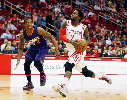 HOUSTON, TX - MARCH 21:  Patrick Beverley #2 of the Houston Rockets takes the basketball up the court in front of Eric Bledsoe #2 of the Phoenix Suns during their game against the Phoenix Sunsat the Toyota Center on March 21, 2015 in Houston, Texas. NOTE TO USER: User expressly acknowledges and agrees that, by downloading and/or using this photograph, user is consenting to the terms and conditions of the Getty Images License Agreement.  (Photo by Scott Halleran/Getty Images)