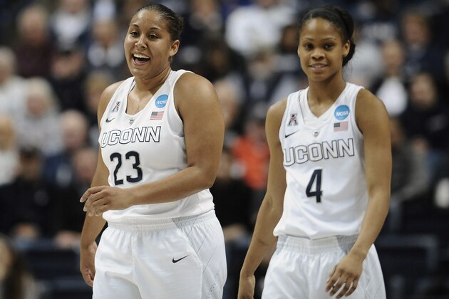 Connecticut’s Kaleena Mosqueda-Lewis and teammate Moriah Jefferson share a light moment during the first half of a women's college basketball game against Rutgers in the second round of the NCAA tournament, Monday, March 23, 2015, in Storrs, Conn. (AP Photo/Jessica Hill)