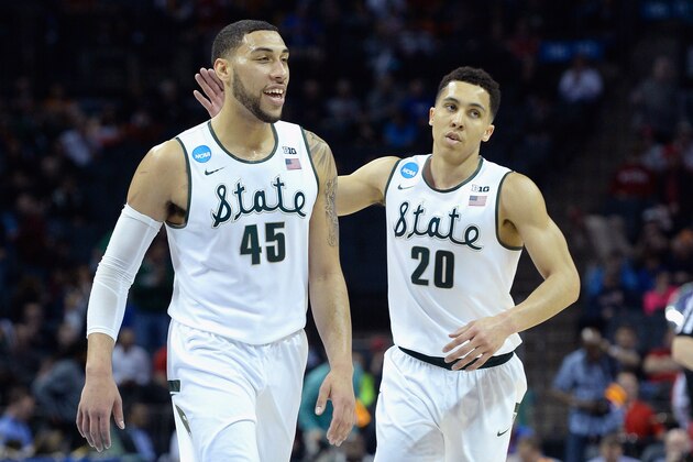 CHARLOTTE, NC - MARCH 20:  Teammates Denzel Valentine #45 and Travis Trice #20 of the Michigan State Spartans react against the Georgia Bulldogs during the second round of the 2015 NCAA Men's Basketball Tournament at Time Warner Cable Arena on March 20, 2015 in Charlotte, North Carolina.  (Photo by Grant Halverson/Getty Images)