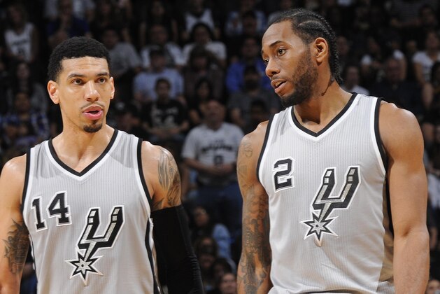 SAN ANTONIO - MARCH 27: Danny Green #14 and Kawhi Leonard #2 of the San Antonio Spurs during the game against the Dallas Mavericks at the AT&T Center on March 27, 2014 in San Antonio, Texas. NOTE TO USER: User expressly acknowledges and agrees that, by downloading and or using this photograph, user is consenting to the terms and conditions of the Getty Images License Agreement. Mandatory Copyright Notice: Copyright 2015 NBAE (Photos by D. Clarke Evans/NBAE via Getty Images)