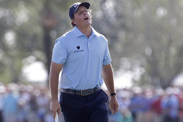 Phil Mickelson reacts after missing an eagle on the 18th hole during the third round of the Honda Classic golf tournament, Sunday, March 1, 2015, in Palm Beach Gardens, Fla. (AP Photo/Alan Diaz)