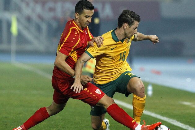 Australia's Nathan Burns, right, challenges with Macedonia's Daniel Georgievski, left, during their international friendly soccer match, at the Philip II Arena, in Skopje, Macedonia, Monday, March 30, 2015. (AP Photo/Boris Grdanoski) Australia's Nathan Burns, right, challenges with Macedonia's Daniel Georgievski, left, during their international friendly soccer match, at the Philip II Arena, in Skopje, Macedonia, Monday, March 30, 2015. (AP Photo/Boris Grdanoski)
