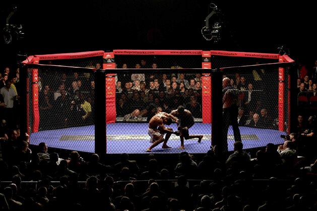 MANCHESTER, UNITED KINGDOM - MARCH 18:  Fighters compete during the World Cage Fighting Championships at the MEN Arena on March 18, 2006 in Manchester, England.  (Photo by Julian Finney/Getty Images)