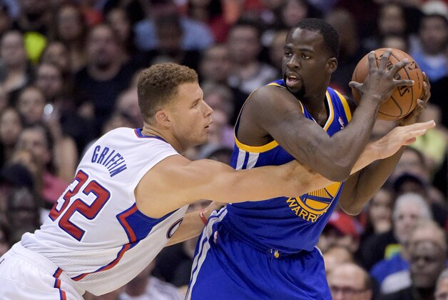 Los Angeles Clippers forward Blake Griffin, tries to grab the ball away from Golden State Warriors forward Draymond Green during the first half in Game 5 of an opening-round NBA basketball playoff series, Tuesday, April 29, 2014, in Los Angeles. (AP Photo)