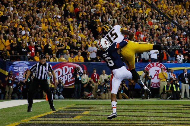 ATLANTA, GA - DECEMBER 07:  Dorial Green-Beckham #15 of the Missouri Tigers scores a touchdown in the first quarter against the Jonathon Mincy #6 of the Auburn Tigers during the SEC Championship Game at Georgia Dome on December 7, 2013 in Atlanta, Georgia.  (Photo by Mike Ehrmann/Getty Images)