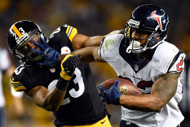 PITTSBURGH, PA - OCTOBER 20:  Arian Foster #23 of the Houston Texans runs the ball in the second quarter against  Mike Mitchell #23 of the Pittsburgh Steelers during their game at Heinz Field on October 20, 2014 in Pittsburgh, Pennsylvania.  (Photo by Joe Sargent/Getty Images)