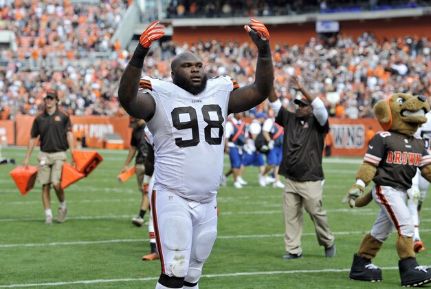 Cleveland Browns defensive end Phil Taylor (98) gestures to fans after a 26-24 win over the New Orleans Saints in an NFL football game Sunday, Sept. 14, 2014, in Cleveland. (AP Photo/David Richard)