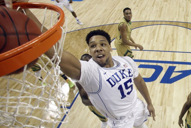 Duke's Jahlil Okafor (15) dunks against Notre Dame during the first half of an NCAA college basketball game in the semifinals of the Atlantic Coast Conference tournament in Greensboro, N.C., Friday, March 13, 2015. (AP Photo/Bob Leverone)