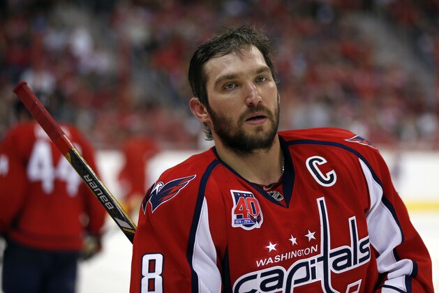 Washington Capitals left wing Alex Ovechkin (8), from Russia, pauses with his helmet off during a timeout in the third period of an NHL hockey game against the New Jersey Devils, Thursday, March 26, 2015, in Washington. The Capitals won 3-2 in overtime. (AP Photo/Alex Brandon)