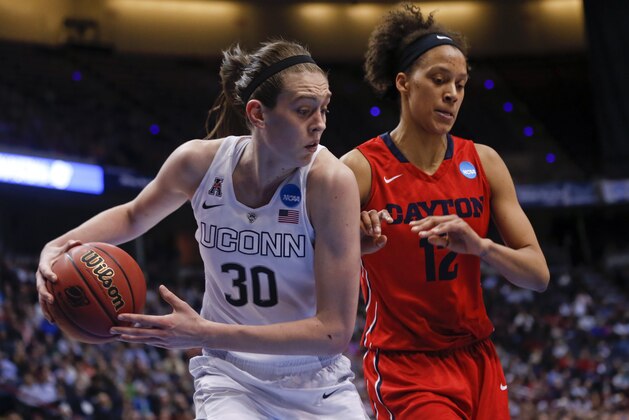 Connecticut forward Breanna Stewart (30) grabs a rebound in front of Dayton center Jodie Cornelie-Sigmundova, of France, during the second half of a regional final game in the NCAA women's college basketball tournament Monday, March 30, 2015, in Albany, N.Y. (AP Photo/Mike Groll)