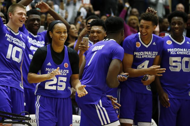 Asia Durr (25), of Atlanta, reacts to her score while competing in the three-point shootout during the McDonald's All-American Jam Fest, Monday, March 30, 2015, in Chicago. Durr finished in first place in the three-point shootout. (AP Photo/Andrew A. Nelles)