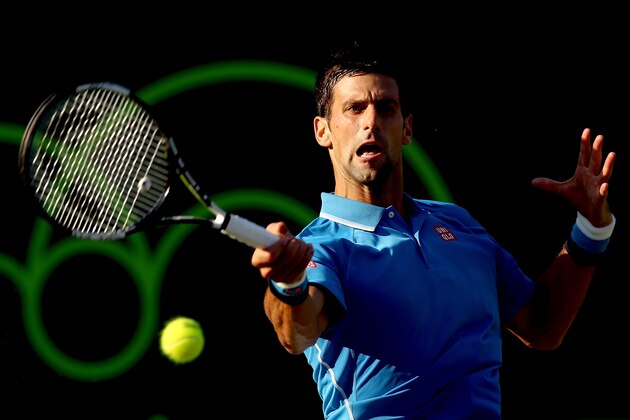KEY BISCAYNE, FL - MARCH 30:  Novak Djokovic of Serbia returns a shot to Steve Darcis of Belgium during day 8 of the Miami Open Presented by Itau at Crandon Park Tennis Center on March 30, 2015 in Key Biscayne, Florida.  (Photo by Matthew Stockman/Getty Images)