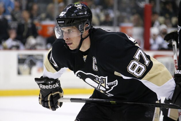 Pittsburgh Penguins' Sidney Crosby (87) prepares to take a face off during the second period of an NHL hockey game against the San Jose Sharks in Pittsburgh Sunday, March 29, 2015. (AP Photo/Gene J. Puskar)