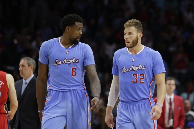 Los Angeles Clippers' DeAndre Jordan, left, and Blake Griffin chat during the second half of an NBA basketball game against the New Orleans Pelicans, Sunday, March 22, 2015, in Los Angeles. The Clippers won 107-100. (AP Photo/Jae C. Hong)