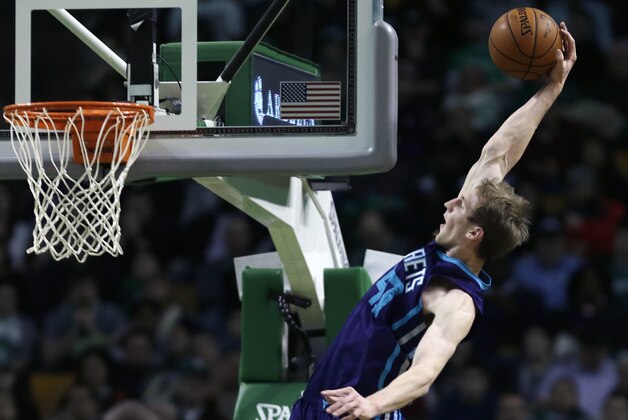 Charlotte Hornets forward Cody Zeller (40) lines up a dunk before losing grip on the ball during the first half of an NBA basketball game against the Boston Celtics in Boston, Friday, Feb. 27, 2015. (AP Photo/Charles Krupa)