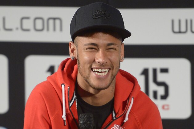 FC Barcelona's Neymar, from Brazil, smiles during the presentation of the International youth football tournament MIC in Barcelona, Spain, Wednesday, March 11, 2015. (AP Photo/Manu Fernandez)