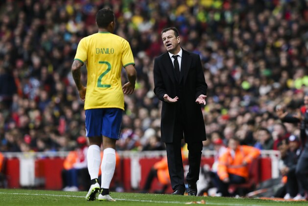 Brazil’s head coach Dunga, right, talks to Brazil’s Danilo, left, during the international friendly soccer match between Brazil and Chile, at the Emirates stadium, in London, Sunday, March 29, 2015. (AP Photo/Tim Ireland)