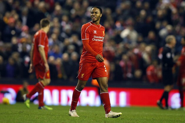 Liverpool's Raheem Sterling grimaces during the English League Cup semi-final first leg soccer match between Liverpool and Chelsea at Anfield Stadium, Liverpool, England, Tuesday Jan. 20, 2015. (AP Photo/Jon Super)