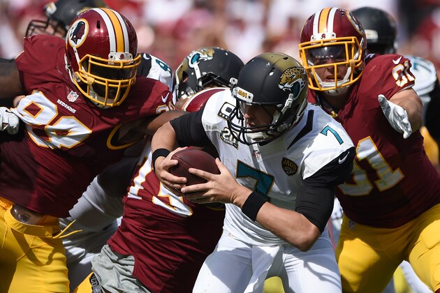 LANDOVER, MD - SEPTEMBER 14: Quarterback Chad Henne #7 of the Jacksonville Jaguars is pulled down by multiple Washington Redskins defenders in the second half at FedExField on September 14, 2014 in Landover, Maryland. The Washington Redskins won, 41-10. (Photo by Patrick Smith/Getty Images)