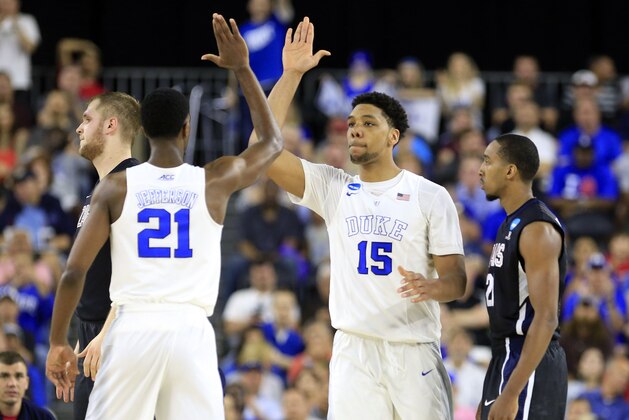 Mar 29, 2015; Houston, TX, USA; Duke Blue Devils center Jahlil Okafor (15) celebrates with forward Amile Jefferson (21) during the first half in the finals of the south regional of the 2015 NCAA Tournament against the Gonzaga Bulldogs at Reliant Stadium. Mandatory Credit: Kevin Jairaj-USA TODAY Sports
