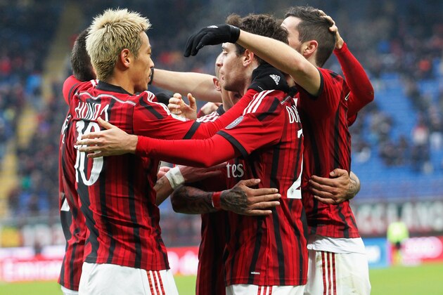 MILAN, ITALY - FEBRUARY 15:  Players of Milan celebrate the opening goal during the Serie A match between AC Milan and Empoli FC at Stadio Giuseppe Meazza on February 15, 2015 in Milan, Italy.  (Photo by Maurizio Lagana/Getty Images)