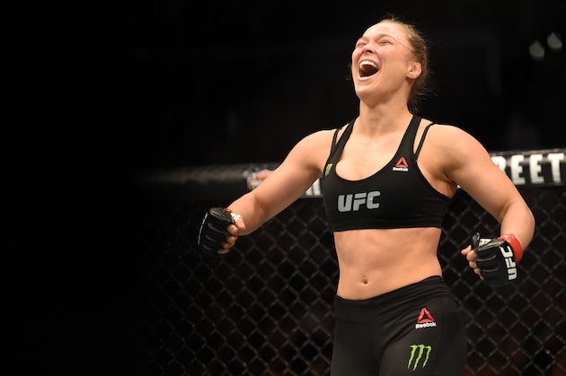 LOS ANGELES, CA - FEBRUARY 28:  Ronda Rousey celebrates her victory over Cat Zingano in their UFC women's bantamweight championship bout during the UFC 184 event at Staples Center on February 28, 2015 in Los Angeles, California.  (Photo by Harry How/Getty Images)