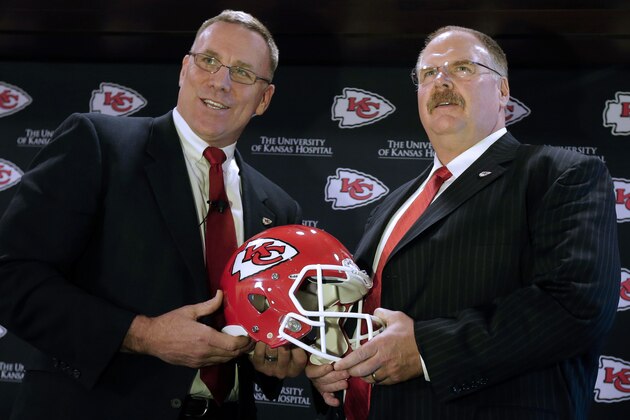 ADVANCE FOR WEEKEND EDITIONS, MARCH 9-10 - FILE - In this Jan. 14, 2013, file photo, Kansas City Chiefs general manager John Dorsey, left, poses with head coach Andy Reid during an NFL football news conference announcing Dorsey's hiring in Kansas City, Mo. The new group in charge of the Chiefs is going right to work, making bold moves to turn around a franchise that went 2-14 last season. (AP Photo/Charlie Riedel, File)