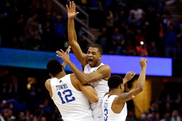 CLEVELAND, OH - MARCH 28: Aaron Harrison #2 of the Kentucky Wildcats celebrates with teammates after defeating the Notre Dame Fighting Irish during the Midwest Regional Final of the 2015 NCAA Men's Basketball tournament at Quicken Loans Arena on March 28, 2015 in Cleveland, Ohio.  (Photo by Gregory Shamus/Getty Images)