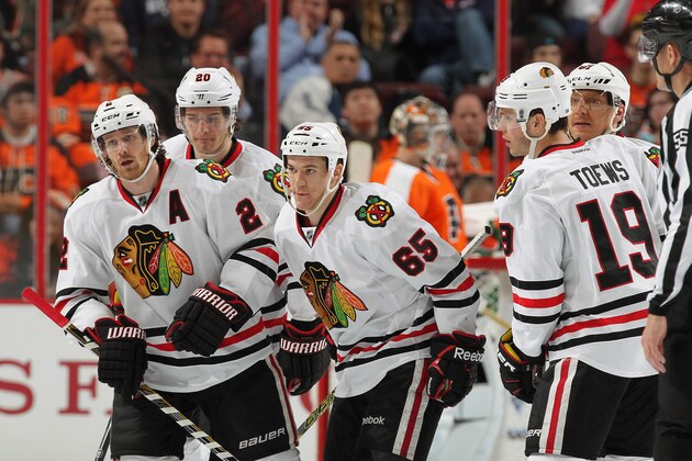 PHILADELPHIA, PA - MARCH 25:  Duncan Keith #2 of the Chicago Blackhawks skates toward his bench following his third period power-play goal against the Philadelphia Flyers with teammates Brandon Saad #20, Andrew Shaw #65, Jonathan Toews #19, and Marian Hossa #81 on March 25, 2015 at the Wells Fargo Center in Philadelphia, Pennsylvania.  (Photo by Len Redkoles/NHLI via Getty Images)