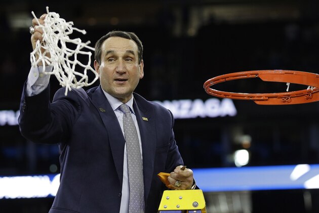 Duke head coach Mike Krzyzewski cuts down the net after a college basketball regional final game against Gonzaga in the NCAA Tournament Sunday, March 29, 2015, in Houston. Duke won 66-52 to advance to the Final Four. (AP Photo/David J. Phillip)