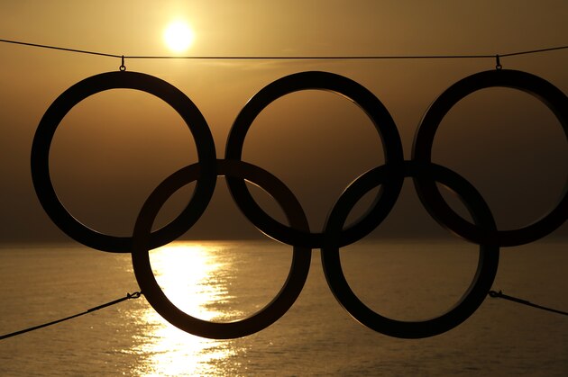 A set of Olympic Rings are silhouetted against the setting sun over the Black Sea a day after the close of the 2014 Winter Olympics, Monday, Feb. 24, 2014, in Sochi, Russia. (AP Photo/Charlie Riedel)