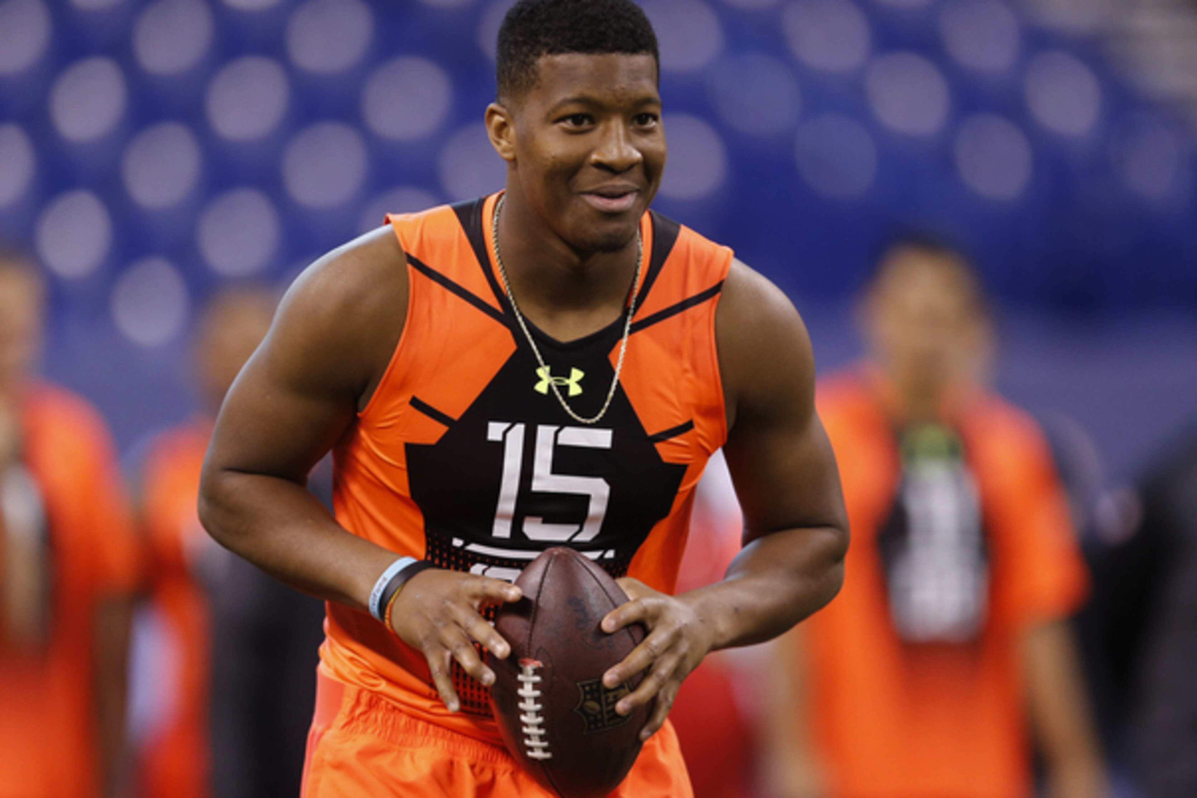 Florida State quarterback Jameis Winston runs a drill at the NFL football scouting combine in Indianapolis, Saturday, Feb. 21, 2015. (AP Photo/Julio Cortez)