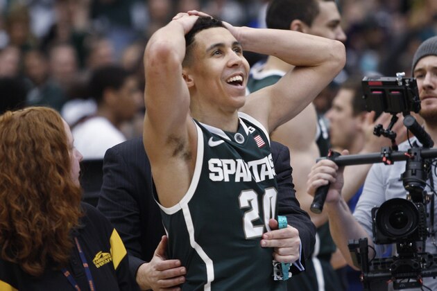 Michigan State's Travis Trice looks up after the regional final against Louisville in the NCAA men's college basketball tournament Sunday, March 29, 2015, in Syracuse, N.Y. Michigan State won 76-70. (AP Photo/Nick Lisi)