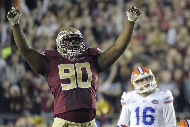 Florida State defensive tackle Eddie Goldman (90) celebrates after Florida place kicker Austin Hardin (16) missed a field goal attempt during the fourth quarter of an NCAA college football game in Tallahassee, Fla., Saturday, Nov. 29, 2014. Florida State won 24-19. (AP Photo/Phelan M. Ebenhack)