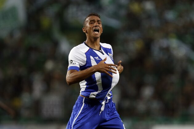 Porto's Danilo Silva celebrates his side's first goal against Sporting during a Portuguese league soccer match between Sporting and Porto at Sporting's Alvalade stadium, in Lisbon, Friday, Sept. 26, 2014. (AP Photo/Francisco Seco)