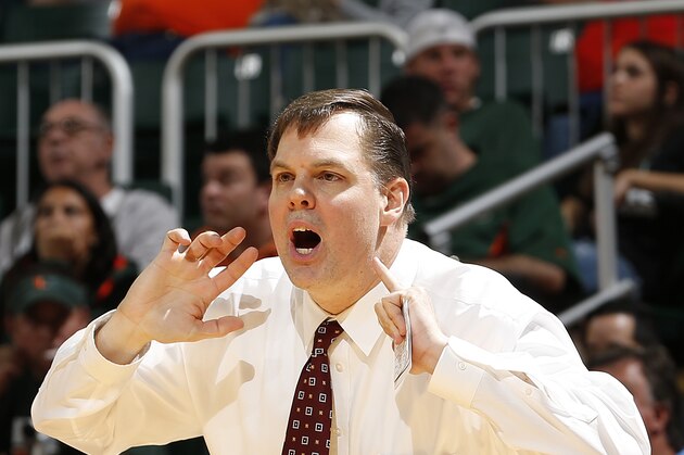 Eastern Kentucky coach Jeff Neubauer talks to his players during the second half of an NCAA college basketball game against Miami in Coral Gables, Fla., Friday, Dec. 19, 2014. Eastern Kentucky defeated Miami 72-44. (AP Photo/Joel Auerbach)