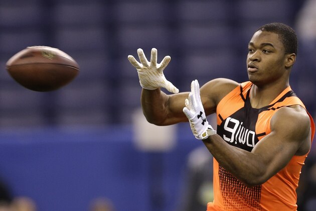 Alabama wide receiver Amari Cooper catches a pass during a drill at the NFL football scouting combine in Indianapolis, Saturday, Feb. 21, 2015. (AP Photo/David J. Phillip)