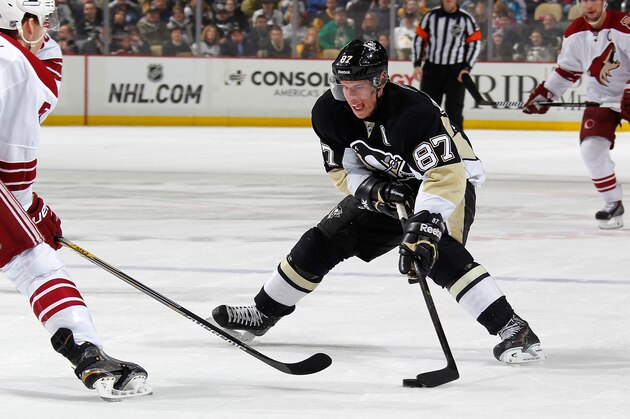 PITTSBURGH, PA - MARCH 28:  Sidney Crosby #87 of the Pittsburgh Penguins moves the puck up ice in front of the defense of Connor Murphy #5 of the Arizona Coyotes at Consol Energy Center on March 28, 2015 in Pittsburgh, Pennsylvania.  (Photo by Gregory Shamus/NHLI via Getty Images)