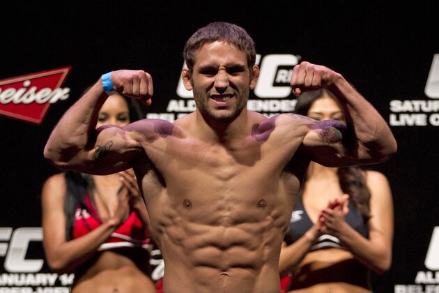 Mixed Martial Arts, MMA, fighter Chad Mendes, from the US, gestures as he weighs-in ahead of the Ultimate Fighting Championship, UFC, 142 in Rio de Janeiro, Brazil, Friday, Jan. 13, 2012.  Mendes will face Jose Aldo, from Brazil, on Friday for the UFC featherweight title. (AP Photo/Felipe Dana)