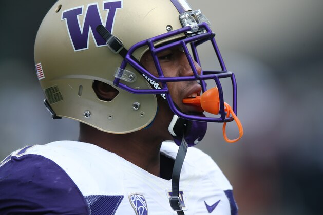 Washington defensive back Marcus Peters warms up before facing Colorado in the first quarter of an NCAA college football game in Boulder, Colo., on Saturday, Nov. 1, 2014. (AP Photo/David Zalubowski)