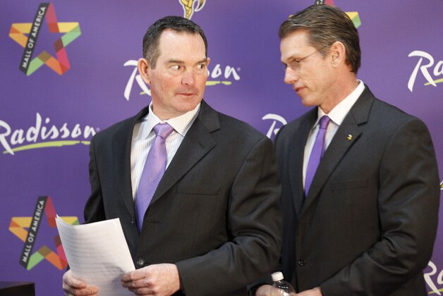 New Minnesota Vikings head coach Mike Zimmer, left, talks with general manager Rick Spielman, right, at Winter Park in Eden Prairie, Minn., Friday, Jan. 17, 2014. Zimmer is the ninth head coach in the Vikings franchise history.(AP Photo/Ann Heisenfelt)
